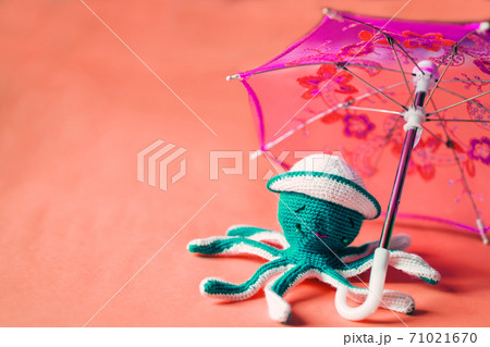 Crochet octopus doll isolated on yellow background Crochet octopus doll isolated on yellow background 71021670