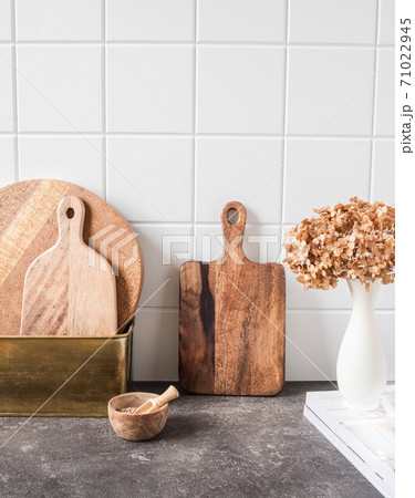 White kitchen background with brown kitchen utensils 71022945