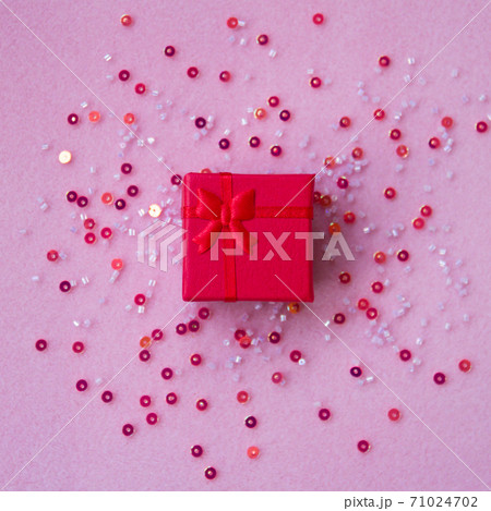 Gift box on a pink background. 71024702