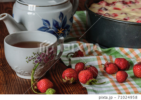 Breakfast with strawberry pie, black tea and berries 71024958
