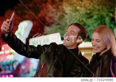 Pretty Smiling Couple Take Selfie on Smartphone Pretty Smiling Couple Take Selfie on Smartphone 71024990