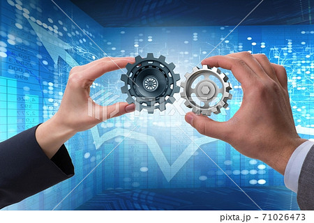 Businessman in teamwork concept with cogwheels Businessman in teamwork concept with cogwheels 71026473