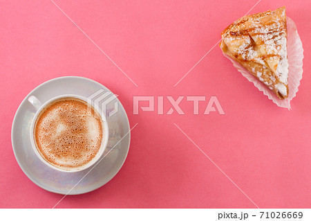 A cup of coffee with cookies. 71026669