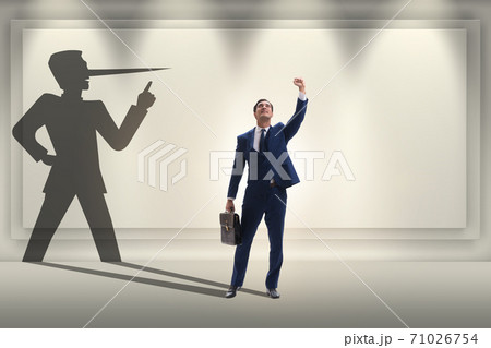 Concept of businessman liar with his shadow Concept of businessman liar with his shadow 71026754