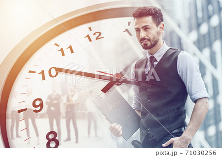 Businessman overlay with clock face for business times working hours concept. Businessman overlay with clock face for business times working hours concept. 71030256