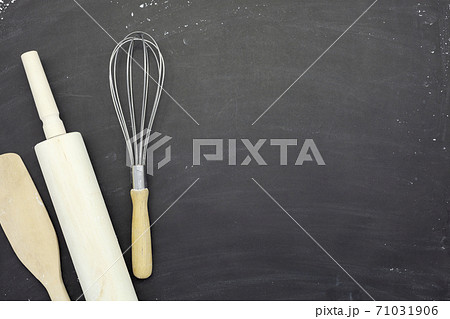 Sprinkle wheat flour with rolling pin ,wooden spoon and Dough preparing copy space for text on dark black wood background, top view for cooking dough or pastry background,Bakery tools on flour Sprinkle wheat flour with rolling pin ,wooden spoon and Dough preparing copy space for text on dark black wood background, top view for cooking dough or pastry background,Bakery tools on flour 71031906