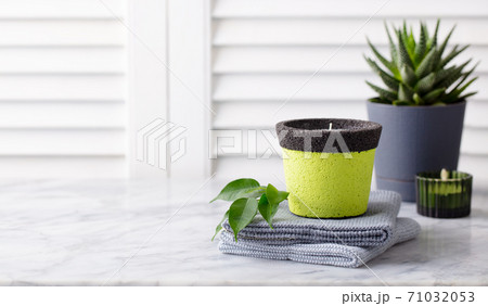 Natural eco home decor, succulent plant, candles, towels on marble table. Wooden white background. Copy space. 71032053
