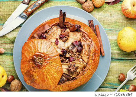 Tasty autumn stuffed pumpkin Tasty autumn stuffed pumpkin 71036864