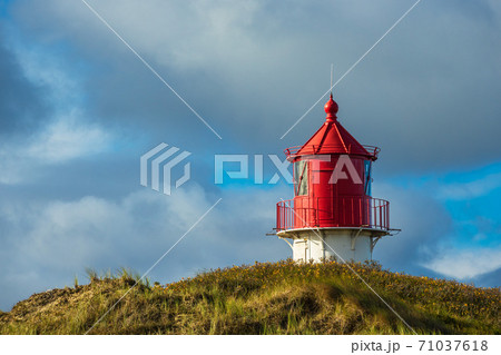 Lighthouse in Norddorf on the North Sea island Amrum, Germany Lighthouse in Norddorf on the North Sea island Amrum, Germany 71037618
