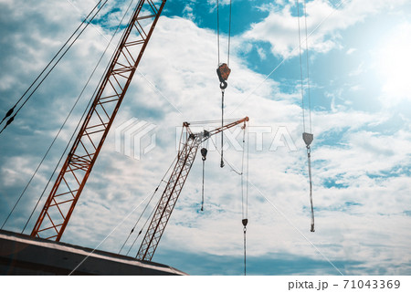 Construction crane against the sky 71043369