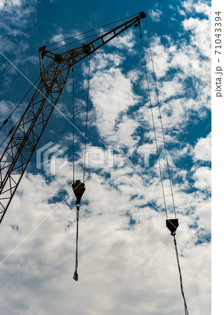 Construction crane against the sky Construction crane against the sky 71043394