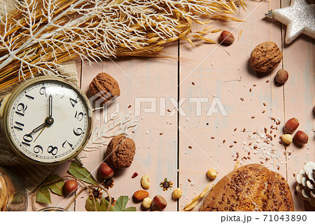 christmas decoration in rustic style and holiday background, still life on wooden backdrop, bread, nuts and other 71043890
