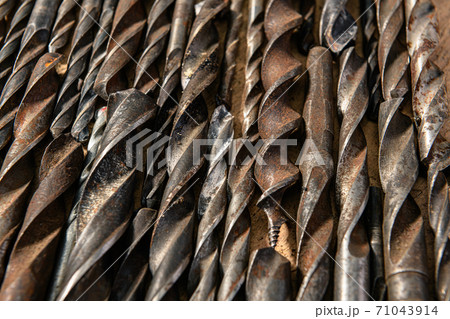 old vintage hand tools - set of drills on a wooden background old vintage hand tools - set of drills on a wooden background 71043914