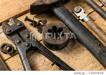 Old vintage household hand tools still life on a wooden background in a DIY and repair concept 71043928