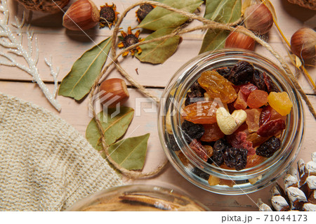 christmas decoration in rustic style and holiday background, still life on wooden backdrop, bread, nuts and other christmas decoration in rustic style and holiday background, still life on wooden backdrop, bread, nuts and other 71044173