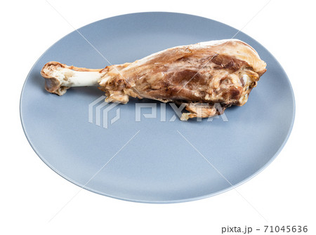 boiled turkey drumstick on blue plate isolated 71045636
