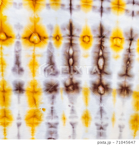abstract yellow and brown pattern in tie-dye batik abstract yellow and brown pattern in tie-dye batik 71045647