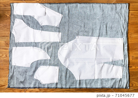 top view of paper sewing pattern layouts on fabric top view of paper sewing pattern layouts on fabric 71045677