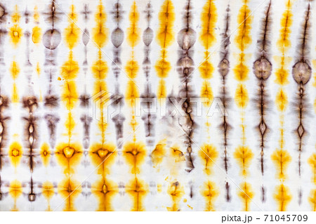 abstract yellow and brown decor in tie-dye batik abstract yellow and brown decor in tie-dye batik 71045709