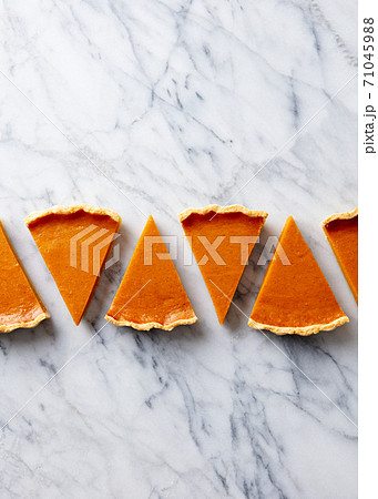 Pumpkin pie, tart pieces for Thanksgiving day. Marble background. Copy space. Top view. 71045988