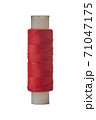Reel with thread and needle on a white background 71047175
