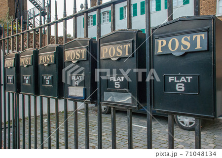 Mailbox on a steel fence 71048134