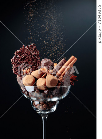 Various chocolates with ingredients. 71049355