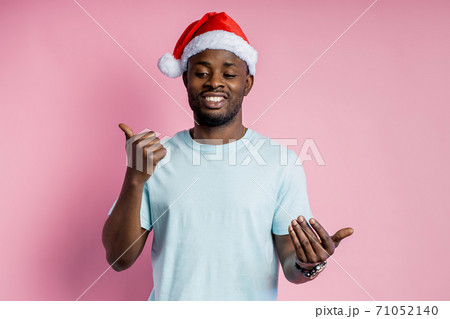 African american man wearing Santa hat 71052140