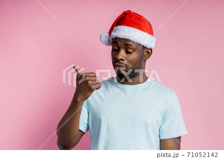 African american man wearing Santa hat African american man wearing Santa hat 71052142