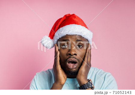 African american man wearing Santa hat African american man wearing Santa hat 71052143