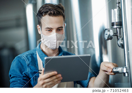 Work with production equipment in modern factory Work with production equipment in modern factory 71052463