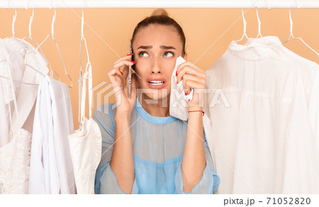Sad woman crying, having nothing to wear 71052820