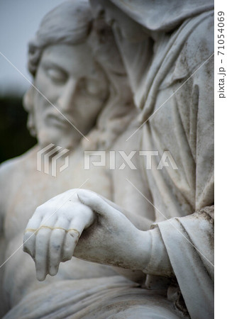 Vertical image of Jesus and Mary in Victorian cemetery pieta statue 71054069