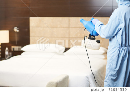 Spray disinfection of surfaces in the hotel room 71054539