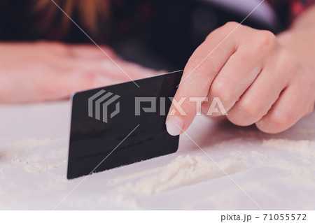 Swag girl sniffing cocaine imitation, flour . blonde Woman stoned. White background. Swag girl sniffing cocaine imitation, flour . blonde Woman stoned. White background. 71055572