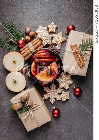 Christmas background with presents and mulled wine Christmas background with presents and mulled wine 71055953