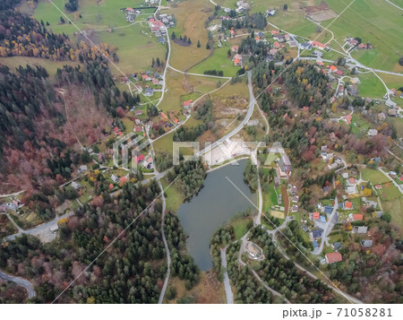 road in the autumn forest drone view 71058281