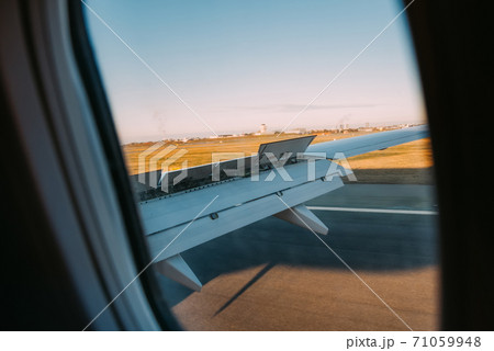 Wing of an airplane landing in Kastrup, Copenhagen airport. 71059948
