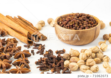 Assorted colorful spices on a white background. Assorted colorful spices on a white background. 71062073