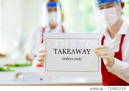 Food takeaway during coronavirus outbreak. 71065210