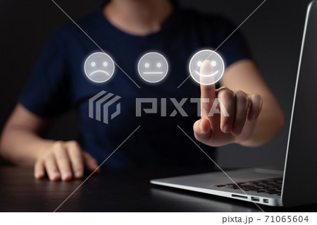 Woman using laptop and emoticon hologram effect. 71065604