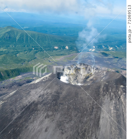 Aerial view to Karymsky volcano, Kamchatka peninsula, Russia 71069513