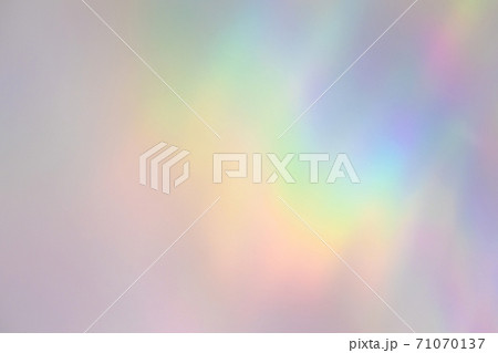 Blurred rainbow light refraction texture on white wall 71070137