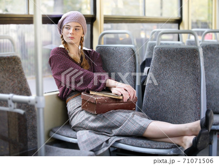 Young pretty student girl in city tram 71071506