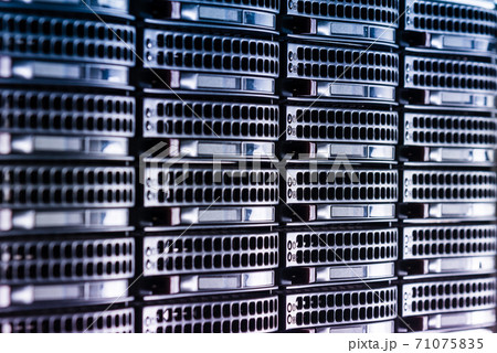 Cluster of data storage hard drives inside server room 71075835