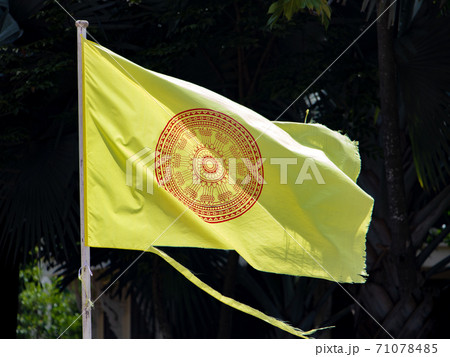 The dhammacakka flag, the symbol of Buddhism in Thailand flying in wind. 71078485