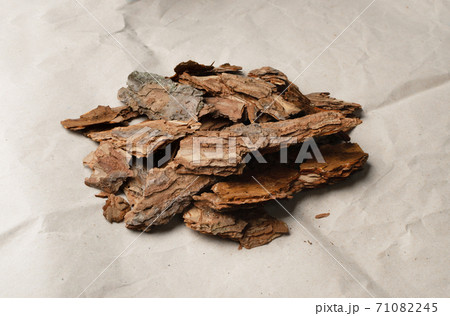 Heap of Pine Tree Bark Chip on Old Paper Background Heap of Pine Tree Bark Chip on Old Paper Background 71082245
