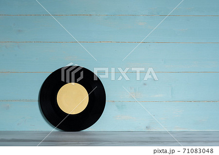 Vinyl record on blue wooden background 71083048