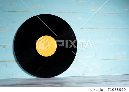 Vinyl record on blue wooden background 71083049