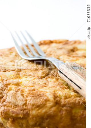 Traditional spanish omelette with potatoes and eggs isolated on white background Traditional spanish omelette with potatoes and eggs isolated on white background 71083336
